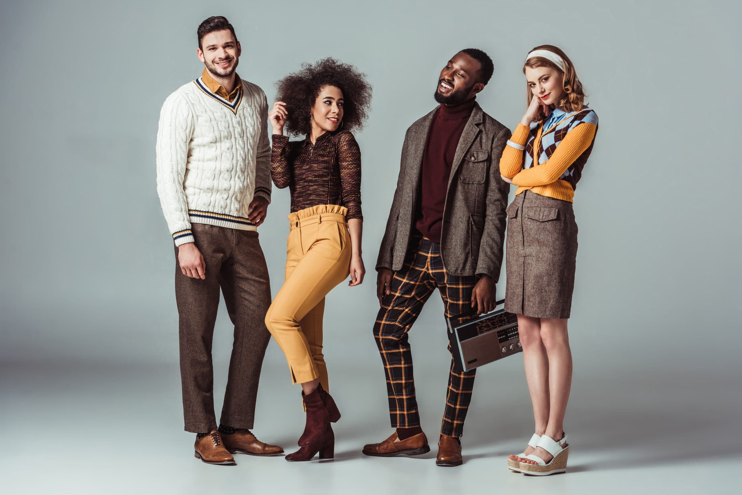 Four fashion-conscious people in an editorial pose